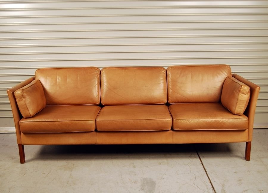 wayfair tan leather sofa with white pillows